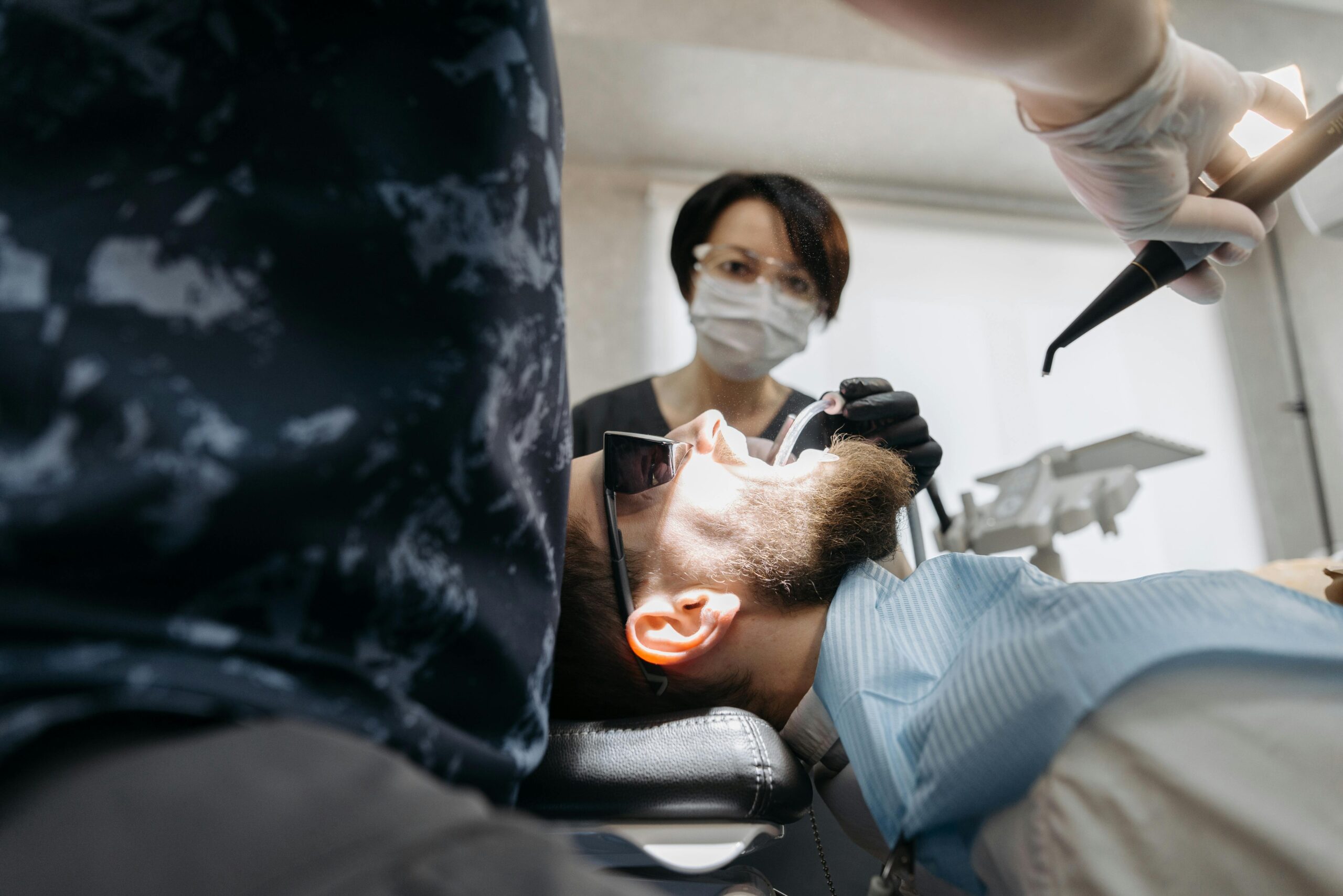 Dentist examining patient